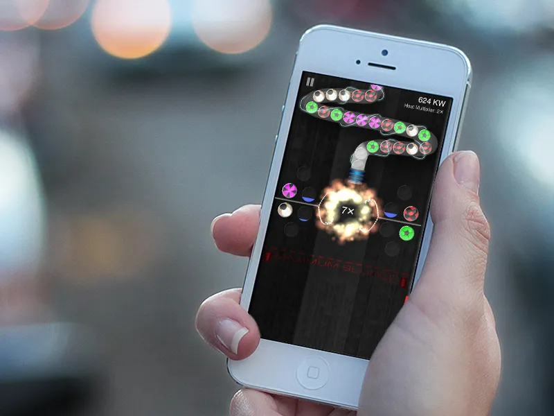 Reactor being played on an iPhone: colored particles feeding into the reactor core